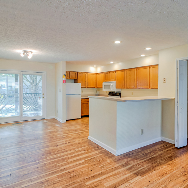 Walnut Springs -  Modern style kitchen equipped with refrigerator, microwave, cooking tools, etc