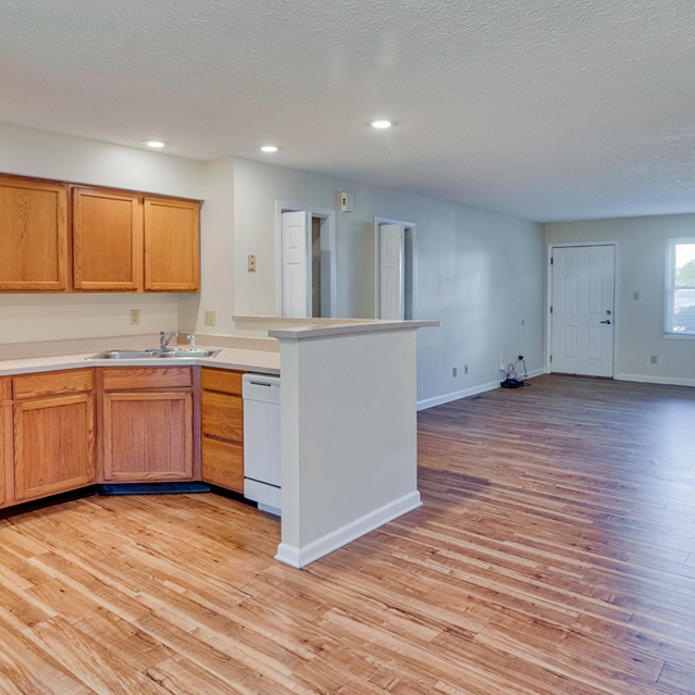 Walnut Springs -  Modern style kitchen equipped with refrigerator, microwave, cooking tools, etc